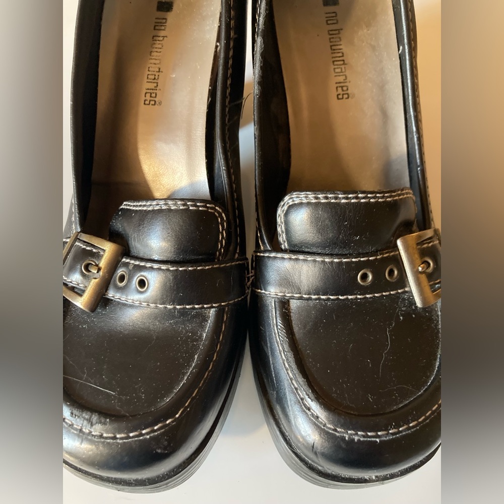 Black buckle heels.